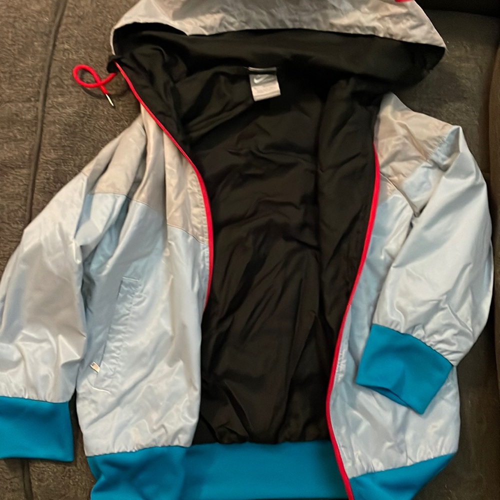 Women Nike light, lightly lined 3/4 sleeve coat.